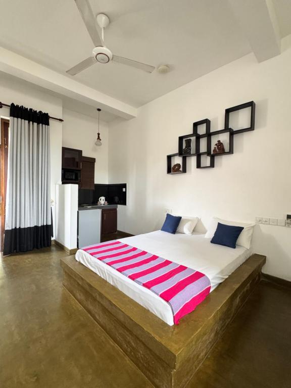 Postel nebo postele na pokoji v ubytování Royal Breeze Negombo