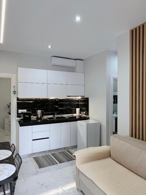 Η κουζίνα ή μικρή κουζίνα στο White and Cozy Apartment