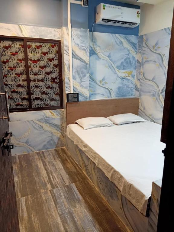 Voodi või voodid majutusasutuse Parivartan Hotel & Lodge toas