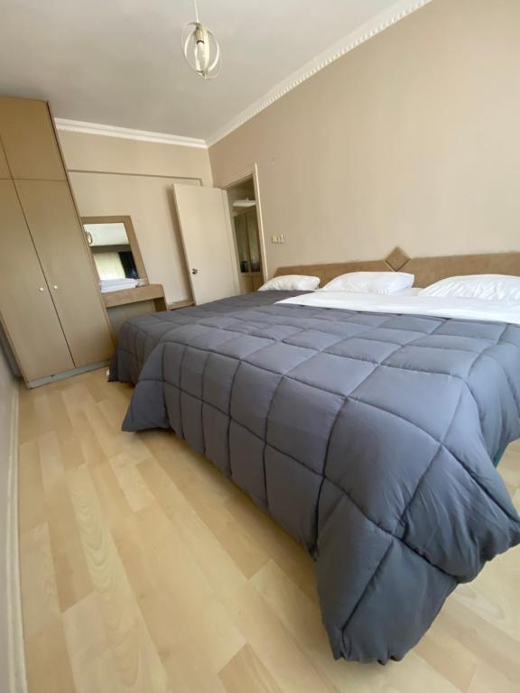Postel nebo postele na pokoji v ubytování EVİM APART HOTEL
