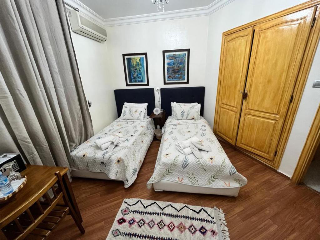 Postel nebo postele na pokoji v ubytování Maison d'hôte Darkom Kech