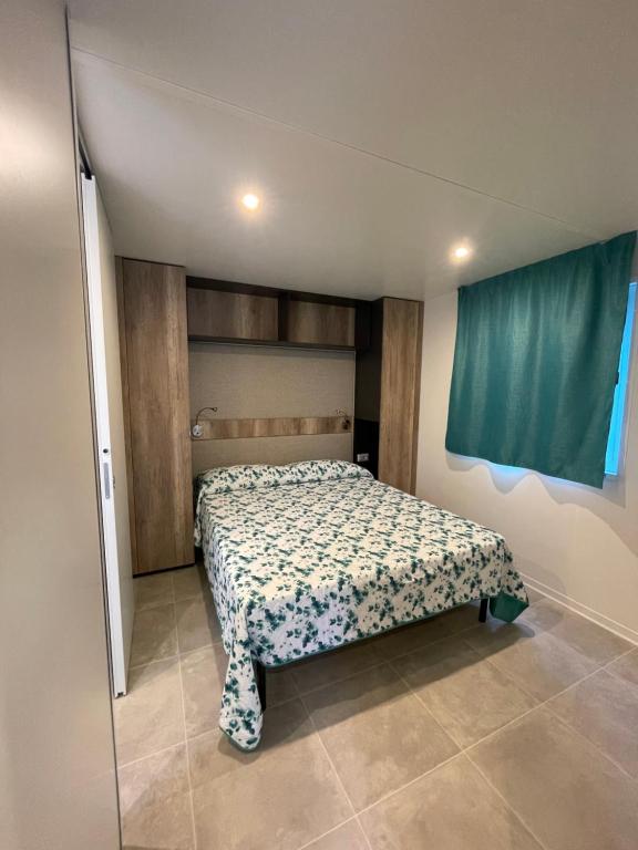 Postel nebo postele na pokoji v ubytování camping feniglia