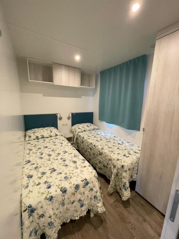 Postel nebo postele na pokoji v ubytování camping feniglia
