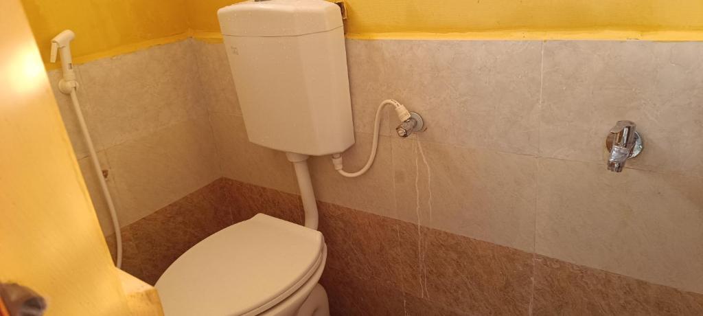 Vannituba majutusasutuses Beverly Dinesh Homestay