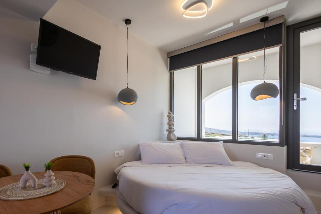 Postel nebo postele na pokoji v ubytování Niabelon Suites