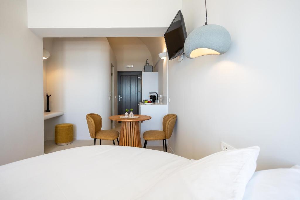 Postel nebo postele na pokoji v ubytování Niabelon Suites