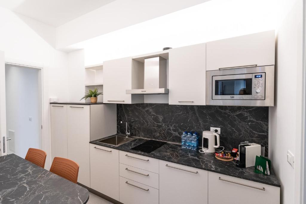 Kuchyň nebo kuchyňský kout v ubytování Frangente Home