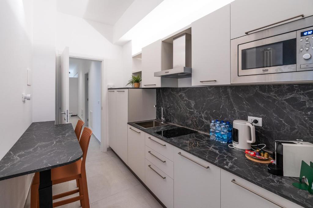 Kuchyň nebo kuchyňský kout v ubytování Frangente Home