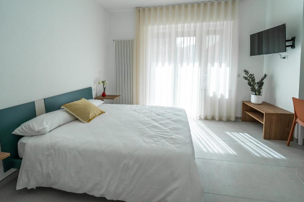 Postel nebo postele na pokoji v ubytování Frangente Home