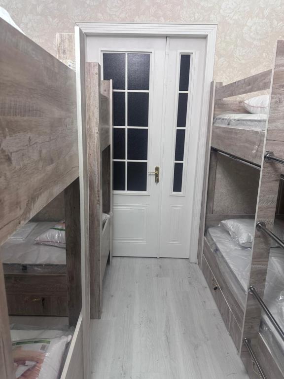 Postel nebo postele na pokoji v ubytování MI Hostel