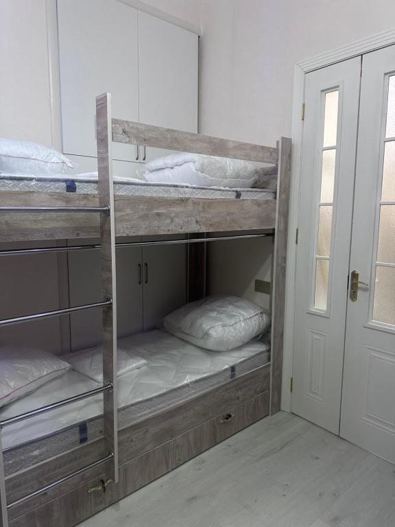 Postel nebo postele na pokoji v ubytování MI Hostel