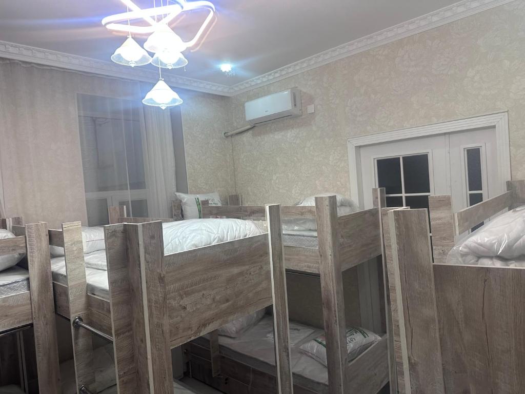 Postel nebo postele na pokoji v ubytování MI Hostel