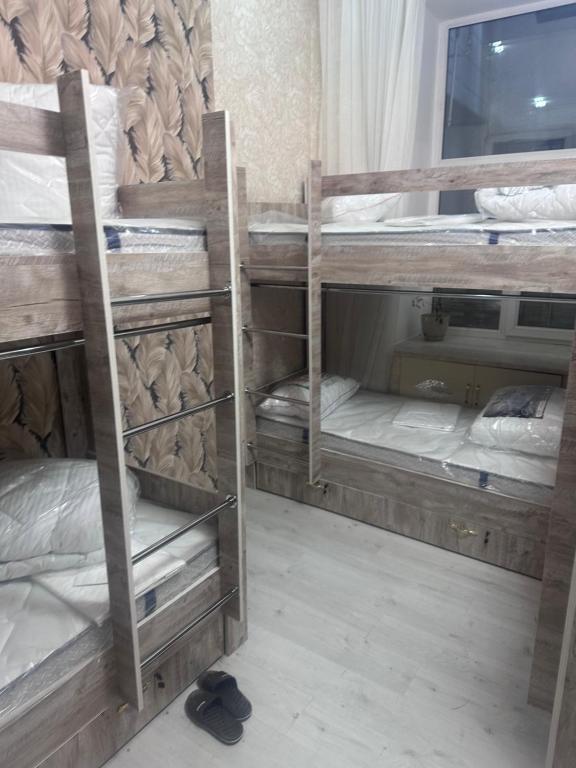 Postel nebo postele na pokoji v ubytování MI Hostel
