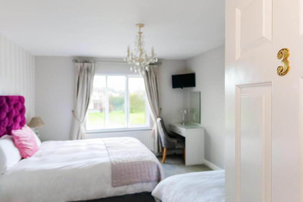 Postel nebo postele na pokoji v ubytování Sea Mist Guesthouse