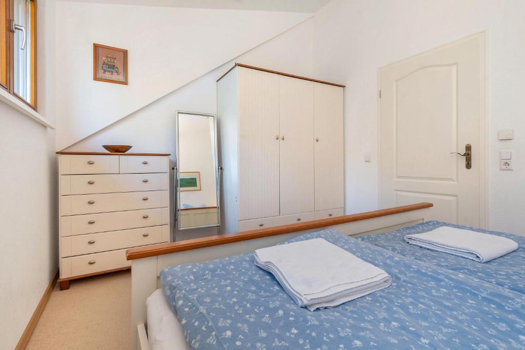 Postel nebo postele na pokoji v ubytování Ferienhaus am Gunzenbach