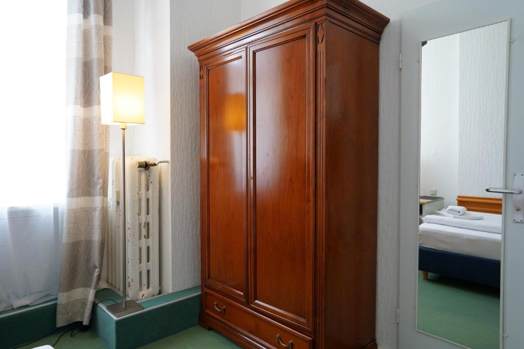 Postel nebo postele na pokoji v ubytování Hotel Ambert