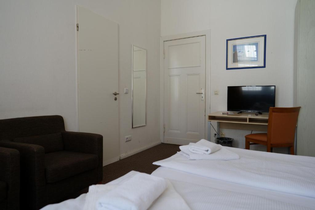 TV a/nebo společenská místnost v ubytování Hotel Ambert
