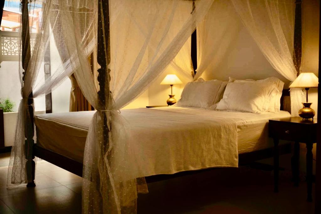 Postel nebo postele na pokoji v ubytování IGN Residence Colombo
