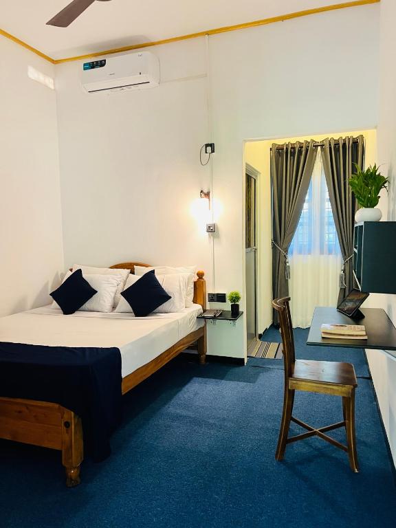 Postel nebo postele na pokoji v ubytování Nilaveli Boutique Hotel