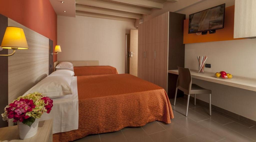 Postel nebo postele na pokoji v ubytování Hotel Aurora Mare