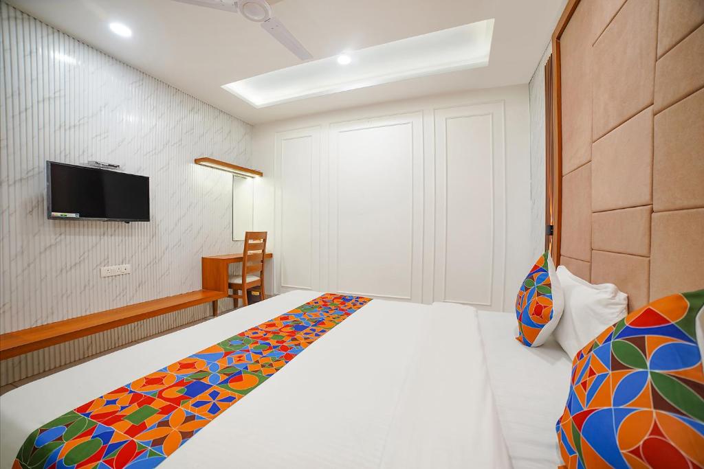 Postel nebo postele na pokoji v ubytování FabHotel Eminent