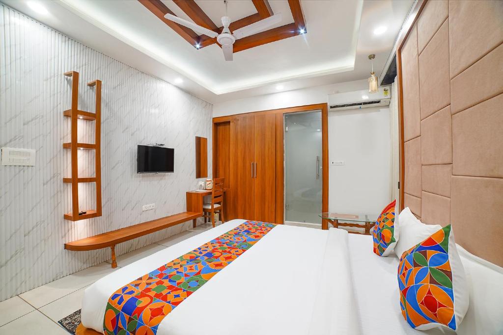 Postel nebo postele na pokoji v ubytování FabHotel Eminent