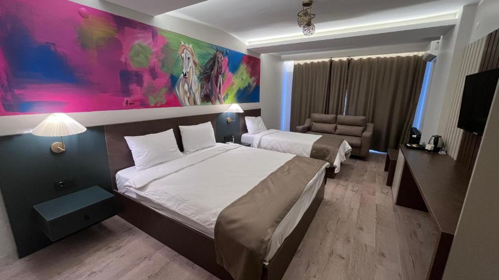 A bed or beds in a room at SAR-PER Hotel