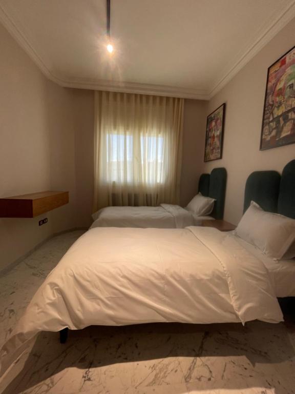 Postel nebo postele na pokoji v ubytování appart hotel lac 2 Tunis