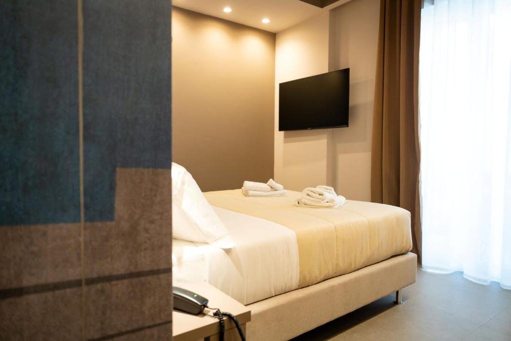 Postel nebo postele na pokoji v ubytování Didimos Town Hotel