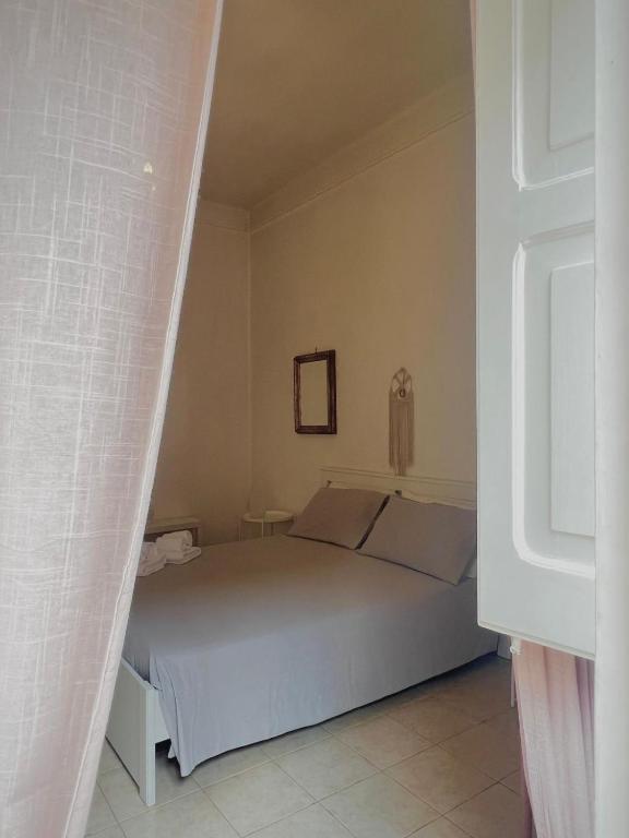 a bedroom with a bed in a room at Casa Myda in Bari