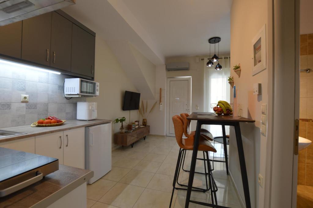 Kuchyň nebo kuchyňský kout v ubytování Harmony Apartments
