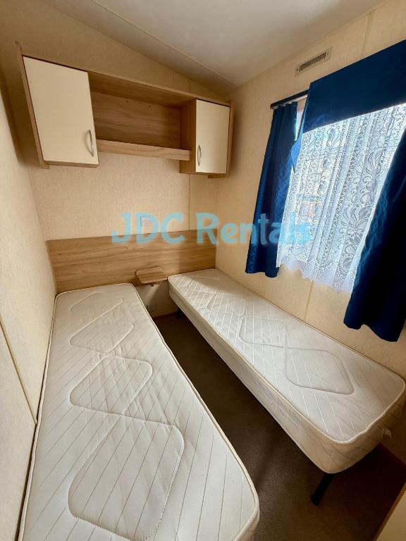 Postel nebo postele na pokoji v ubytování Golden Sands & Winkups
