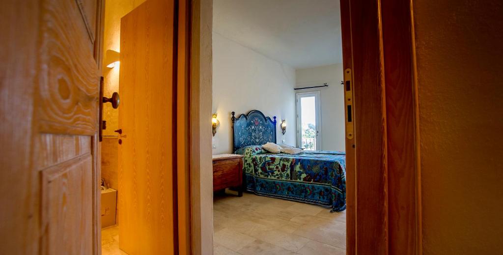 Postel nebo postele na pokoji v ubytování Antica Dimora La Corona
