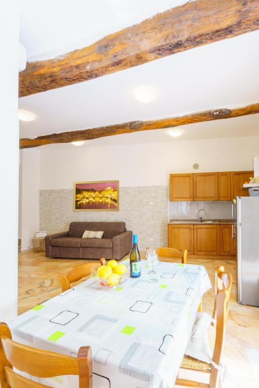 a kitchen and a dining room with a table at Da Rocky in Riomaggiore