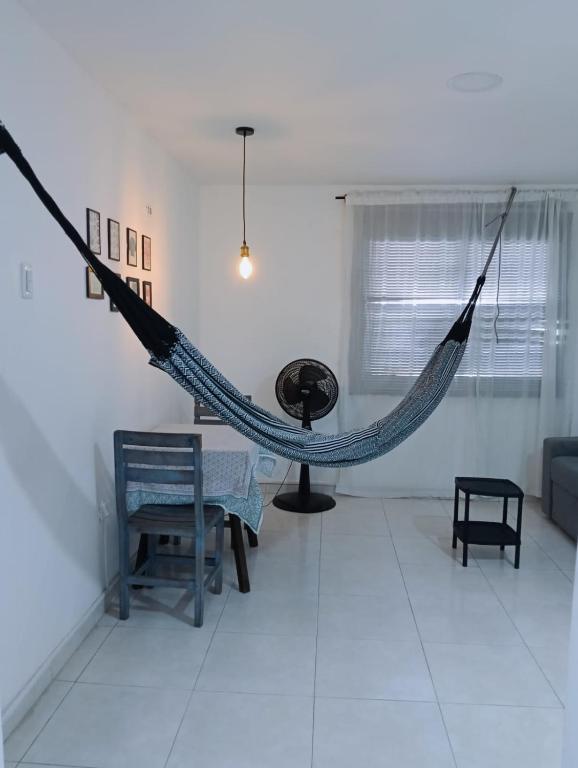 a room with a hammock in the middle of a room at Apartamento en centro histórico in Cartagena de Indias