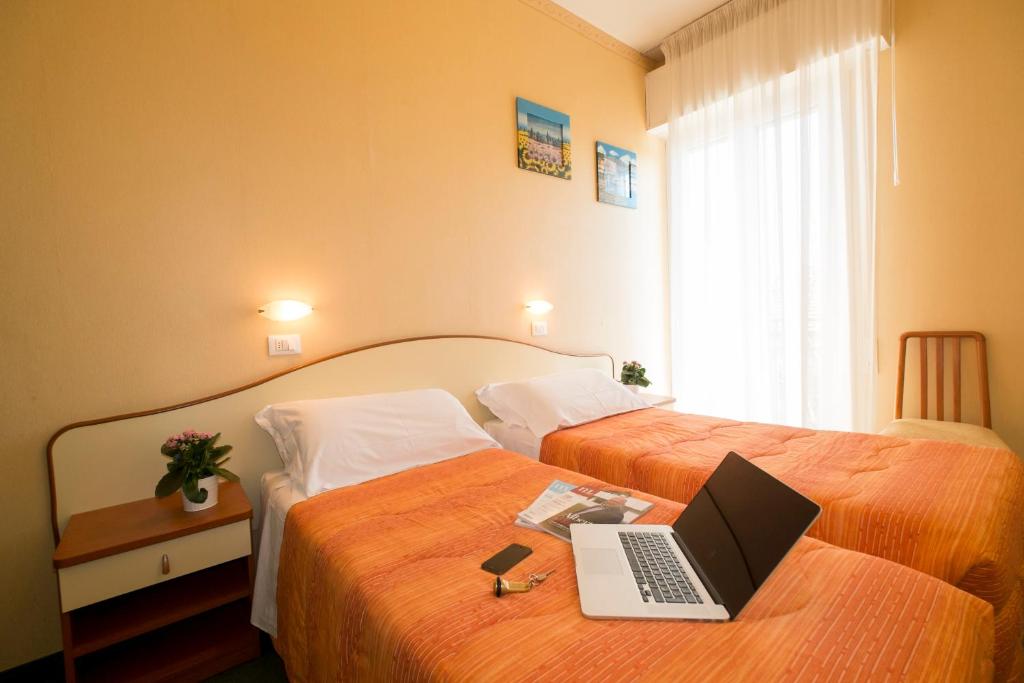 Postel nebo postele na pokoji v ubytování Hotel Crosal