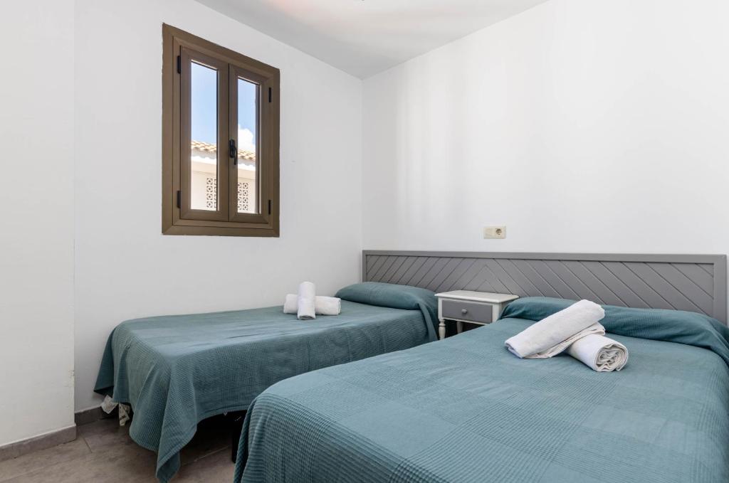 Postel nebo postele na pokoji v ubytování Alcudia Apartments