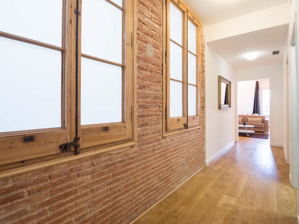 A bed or beds in a room at Rent Top Apartments Rambla Catalunya
