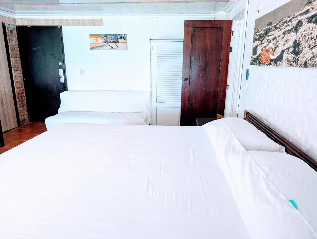 Postel nebo postele na pokoji v ubytování Dios es Fiel - Ali Hotel