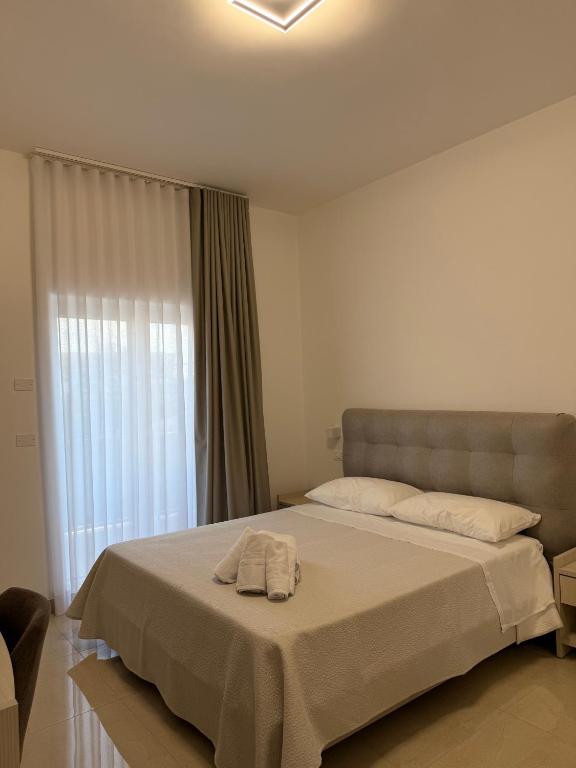 Postel nebo postele na pokoji v ubytování La Dimora Degli Dei