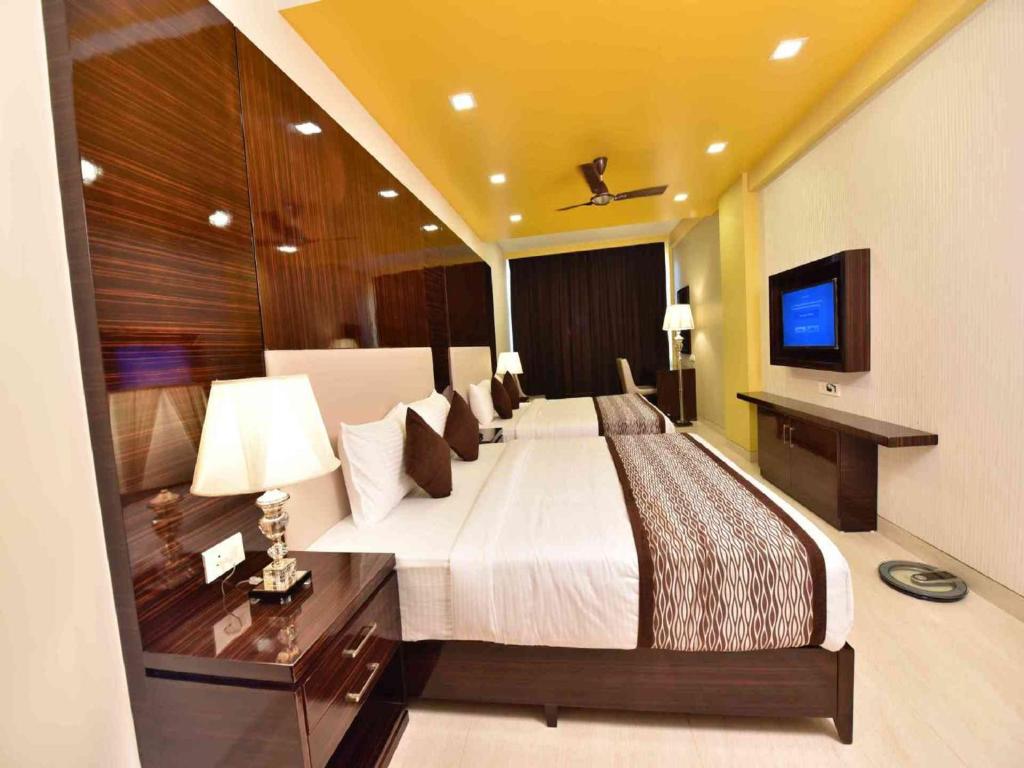 Postel nebo postele na pokoji v ubytování Hotel Calangute Central