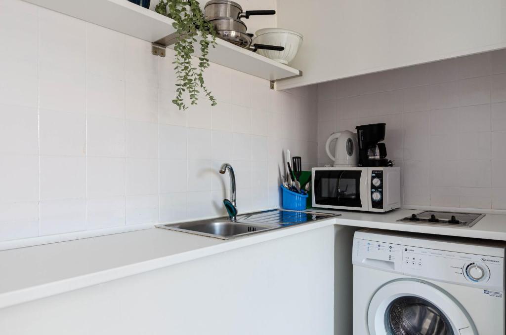 Kuchyň nebo kuchyňský kout v ubytování Alcudia Apartments