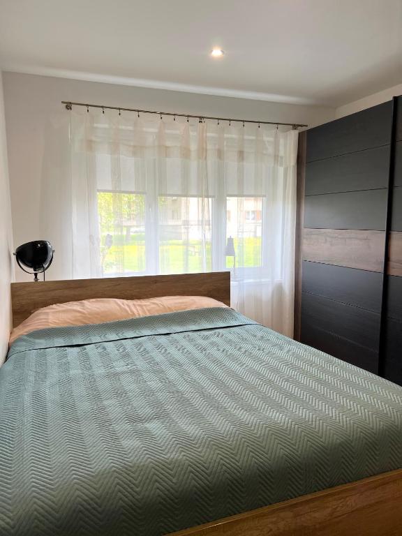 Postel nebo postele na pokoji v ubytování Cosy Flat