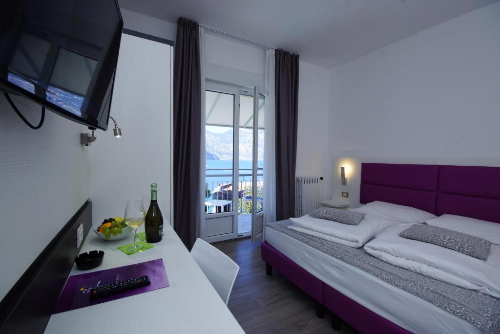 Postel nebo postele na pokoji v ubytování Hotel Casa Serena