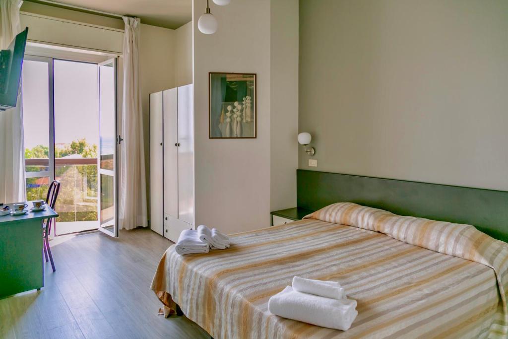 Postel nebo postele na pokoji v ubytování Hotel Airone