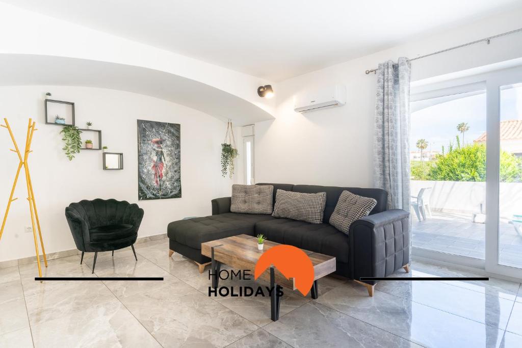 a living room with a couch and a table at #268 Marvellous Villa Sapphire in Albufeira