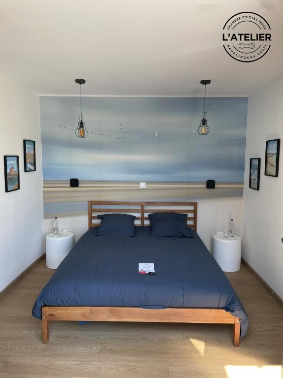 Postel nebo postele na pokoji v ubytování L'Atelier