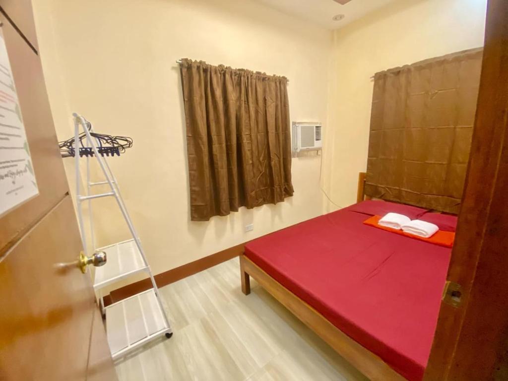 Postel nebo postele na pokoji v ubytování G-Home Stay Palawan