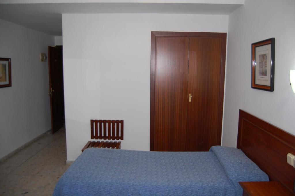 Łóżko lub łóżka w pokoju w obiekcie Hotel Marina Victoria