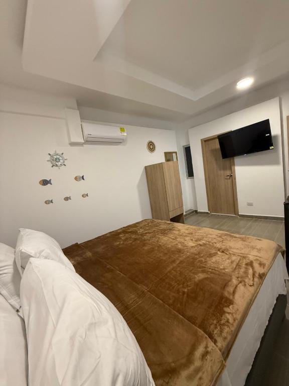 Postel nebo postele na pokoji v ubytování Davé Paradise 2
